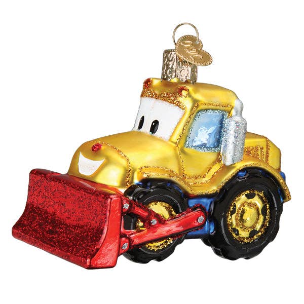 Glass ornament of a yellow bulldozer with red blade on a white background