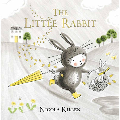 hardcover book titled "The Little Rabbit" with a little girl running through the field dressed as a rabbit. 