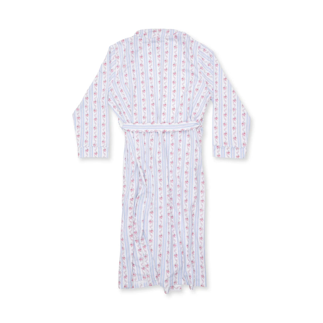 A white bamboo bathrobe with vertical pink and blue stripes and a repeating small floral pattern, featuring a matching tie belt.