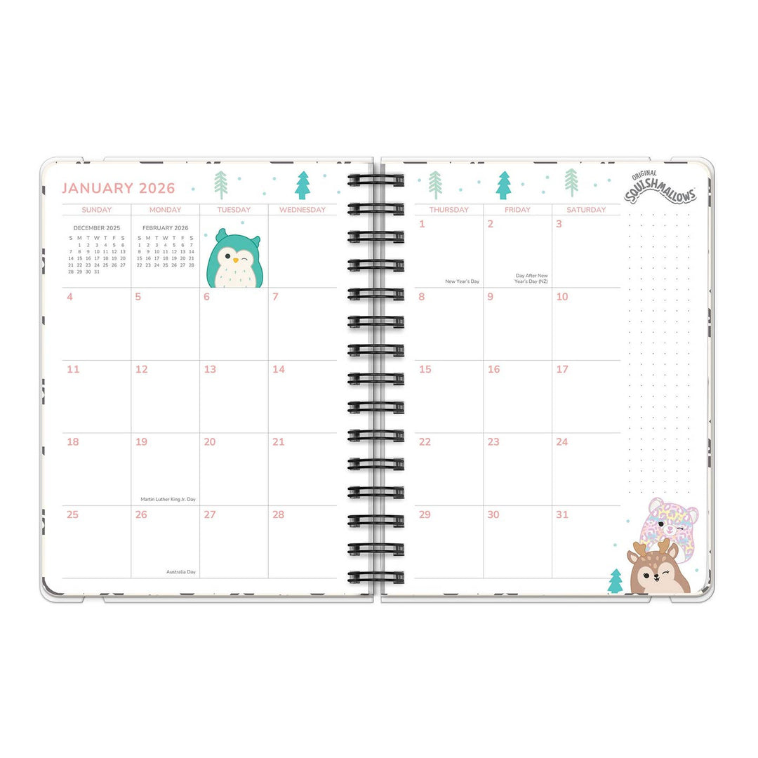 Open planner showing January 2026 calendar with cute animal illustrations on a white background