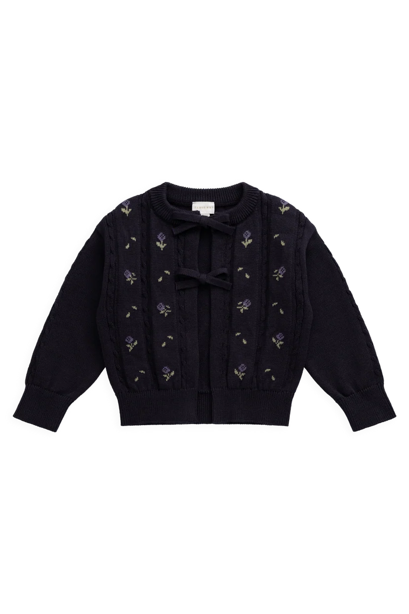 A dark navy blue knit cardigan sweater with long sleeves, featuring a crew neck, a central bow, and delicate floral embroidery in purple and green along the front.