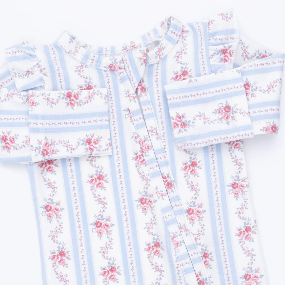 A long-sleeve baby footie featuring a white base with light blue vertical stripes and pink floral prints, laid flat on a white background.