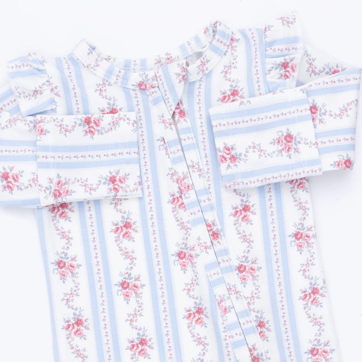A long-sleeve baby footie featuring a white base with light blue vertical stripes and pink floral prints, laid flat on a white background.