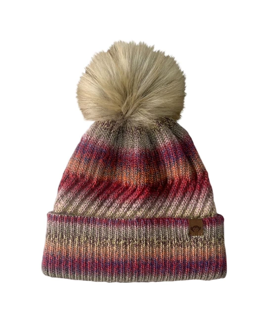 Multicolored striped beanie with a pom-pom on a white background