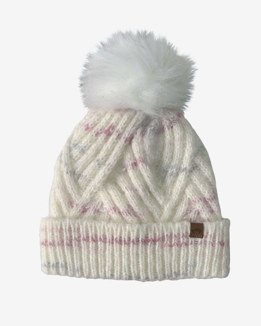ivory beanie with pom pom with laevnder threads running through it. 