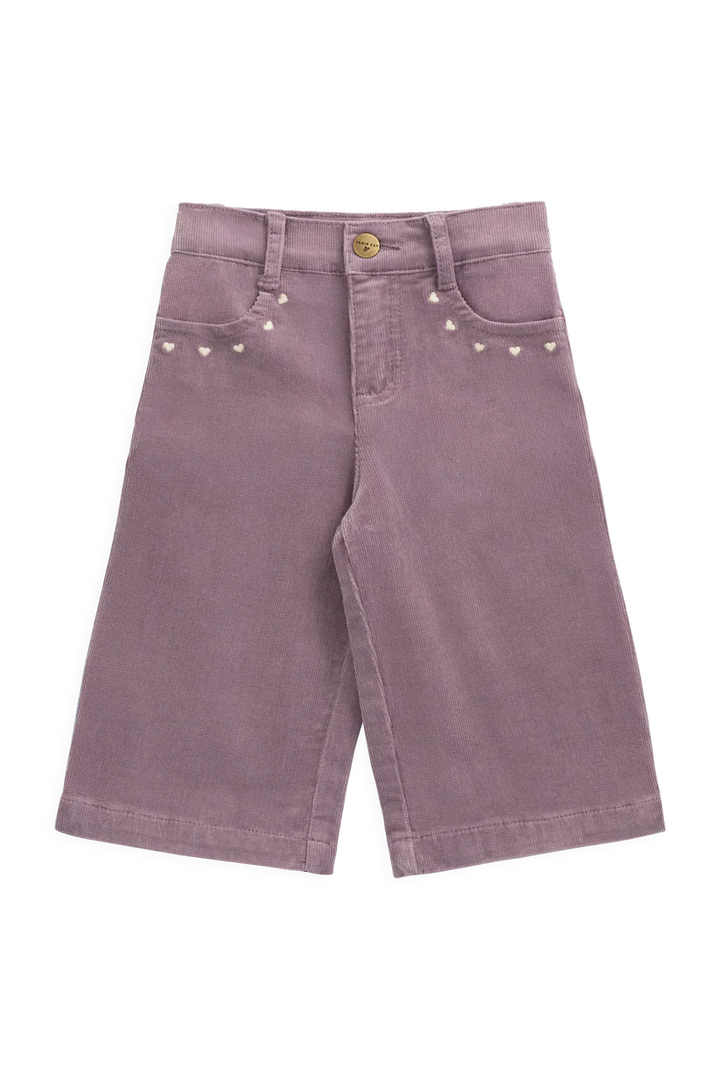 Purple pants with decorative studs on a white background