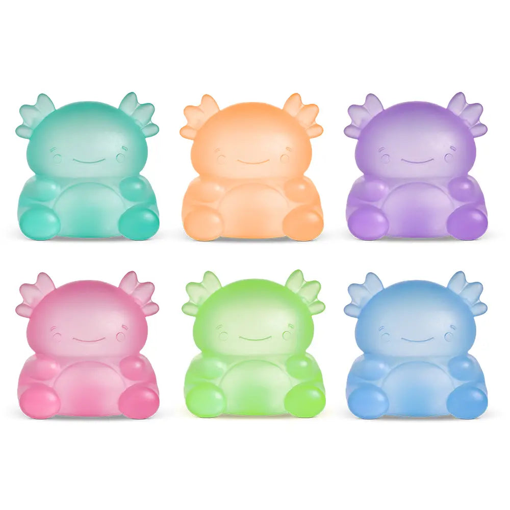 Set of six colorful, cartoon-like creature squish toys on a white background