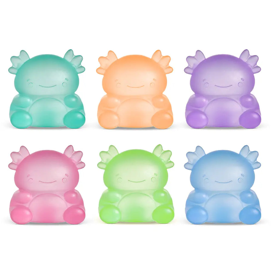 Set of six colorful, cartoon-like creature squish toys on a white background