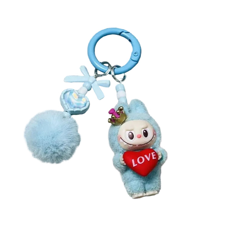Blue plush keychain with a character holding a 'LOVE' heart on a textured gray background