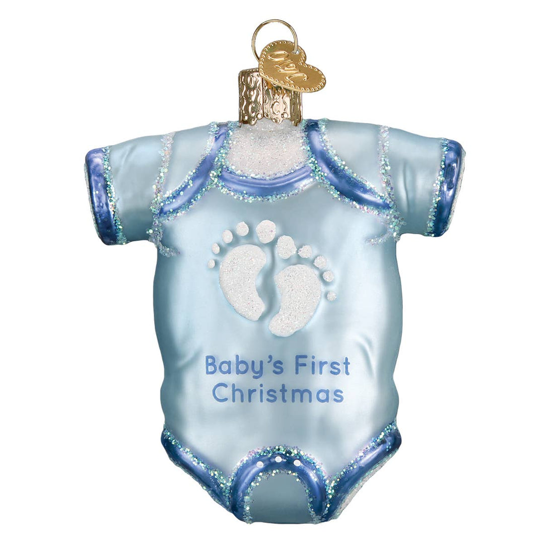 Decorative ornament shaped like a baby onesie with 'Baby's First Christmas' text on a white background.