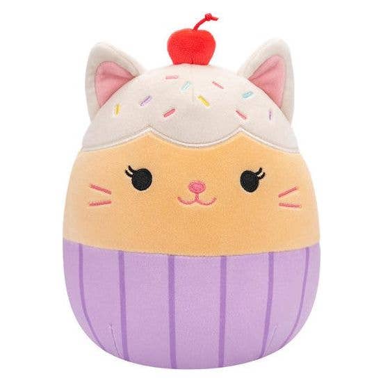 Plush toy resembling a cat with a cherry on top