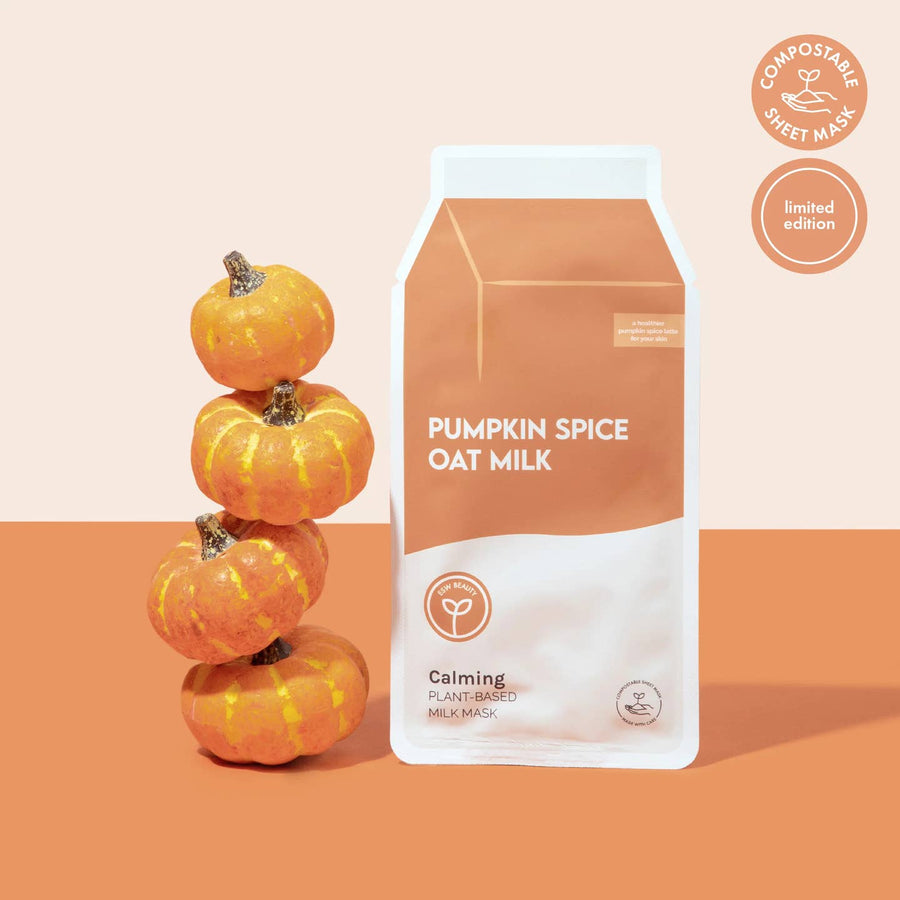 Packaging of pumpkin spice oat milk face mask with decorative pumpkins on a two-tone background