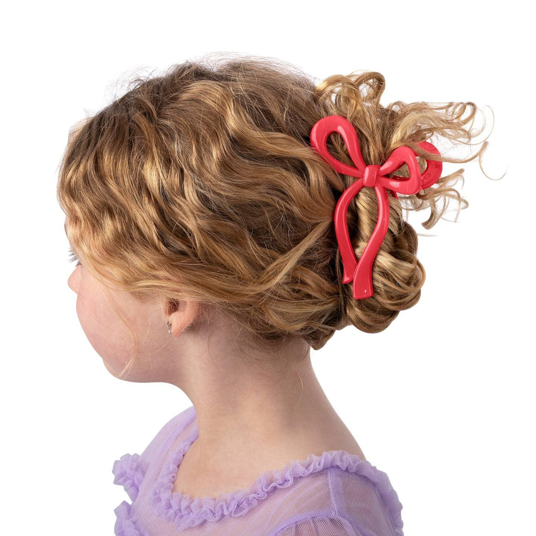 little girl's hair clipped up with the claw clip