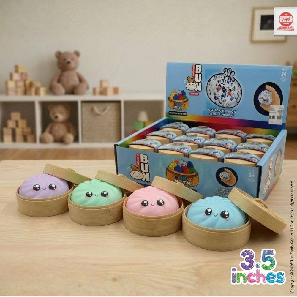 Set of colorful plush toys in bamboo steamers with a box labeled 'I BUN' on a wooden surface.