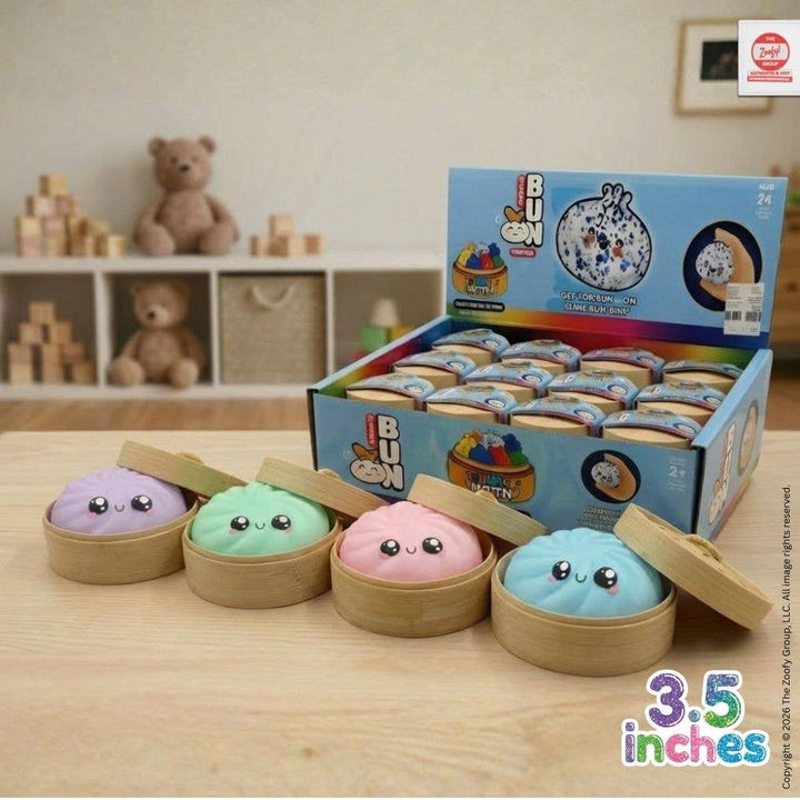 Set of colorful plush toys in bamboo steamers with a box labeled 'I BUN' on a wooden surface.