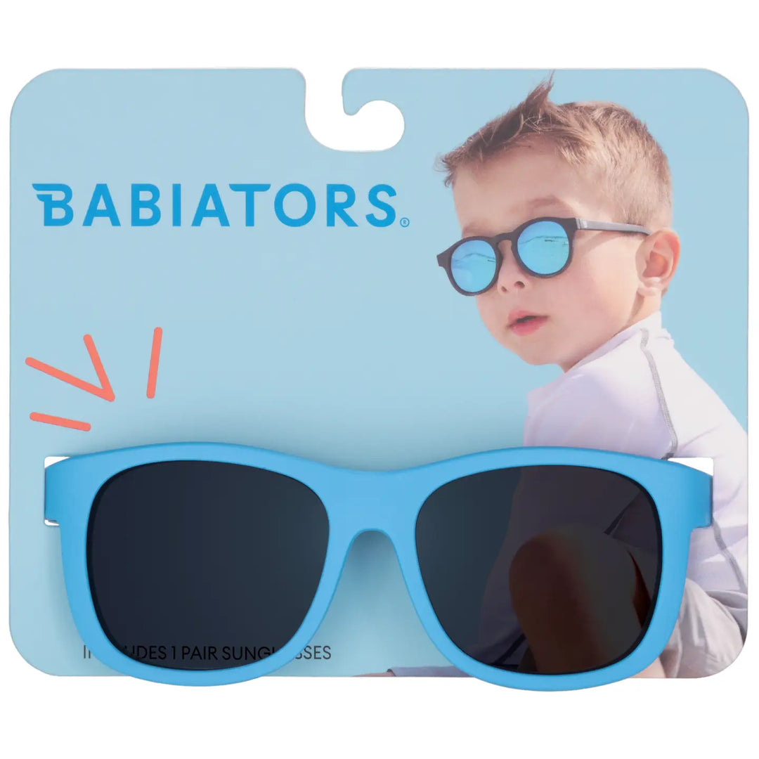 Babiators sunglasses packaging with a child model on a light blue background
