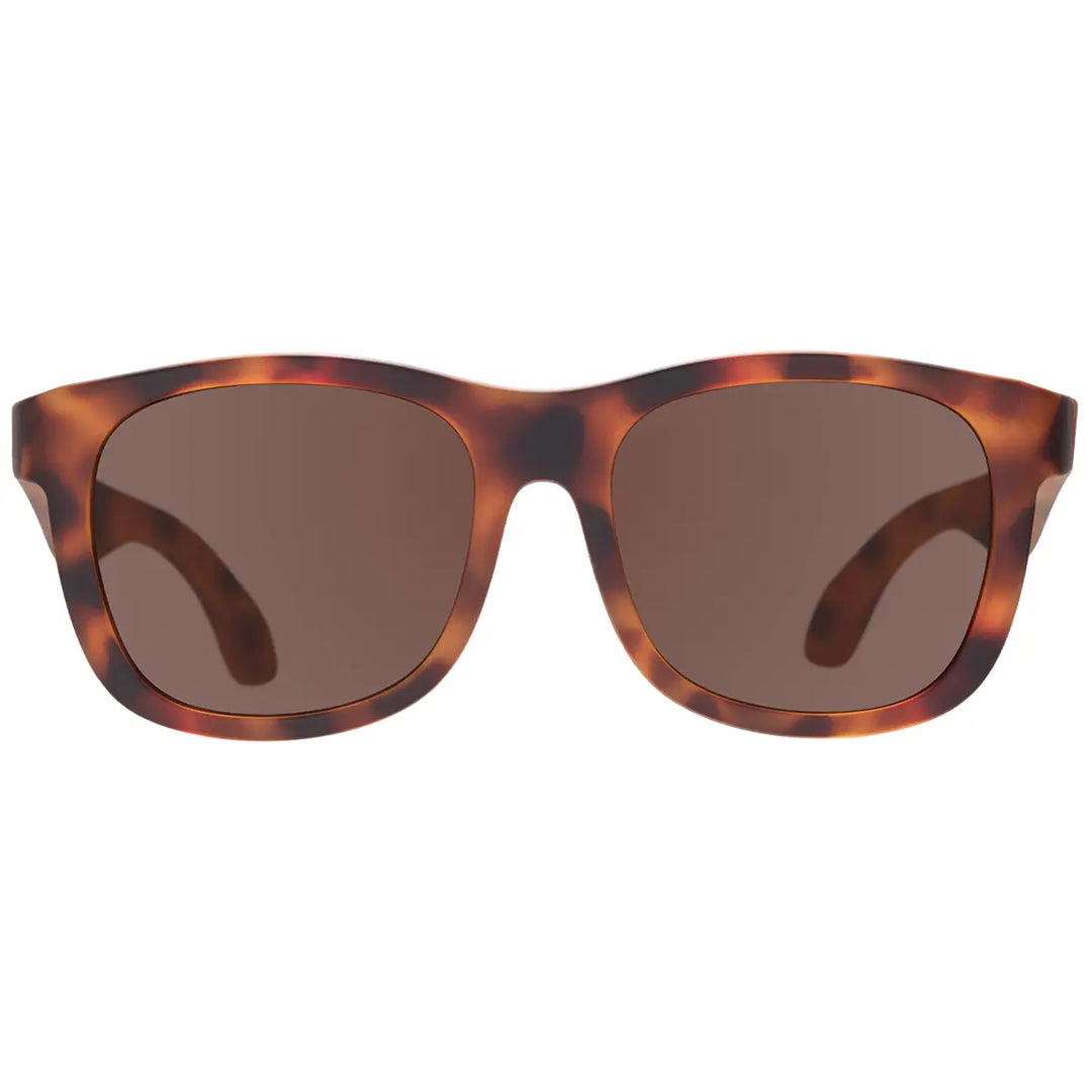 Sunglasses with tortoiseshell frame and brown lenses on a white background
