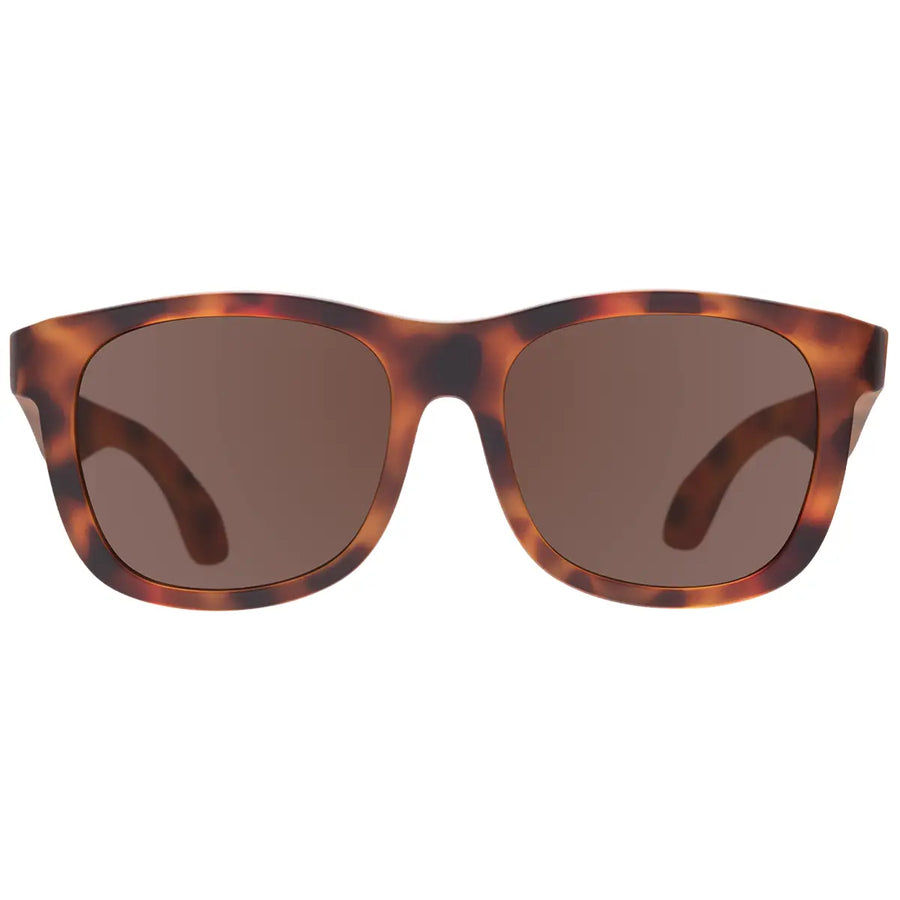 Sunglasses with tortoiseshell frame and brown lenses on a white background