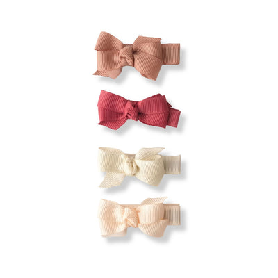 set of 4 bows, grosgrain ribbon on alligator clips: dusty rose, cream, light pink and a dusty red. 