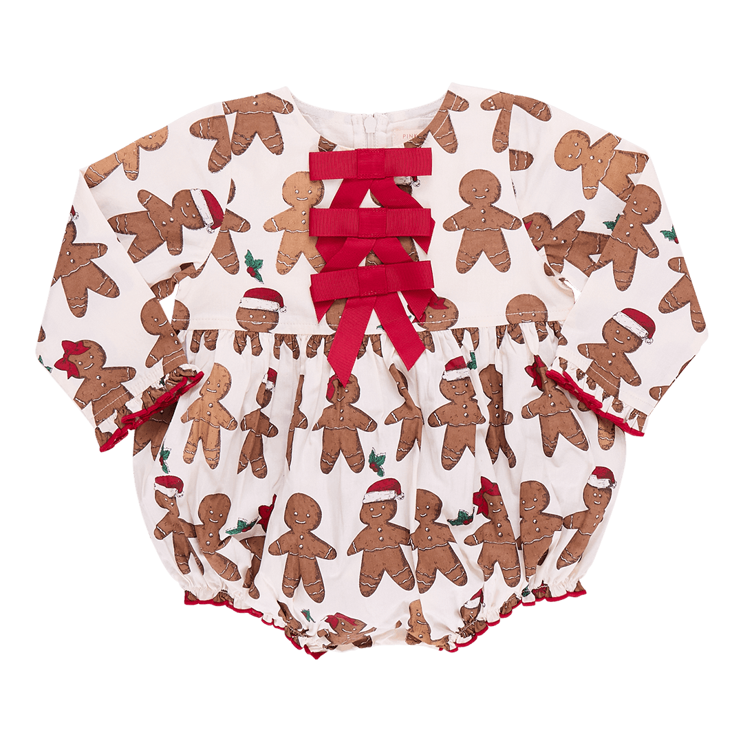 baby bubble, long sleeves with 3 red bows at the top of the chest. ivory background color with gingerbread boy and girl print on it. 