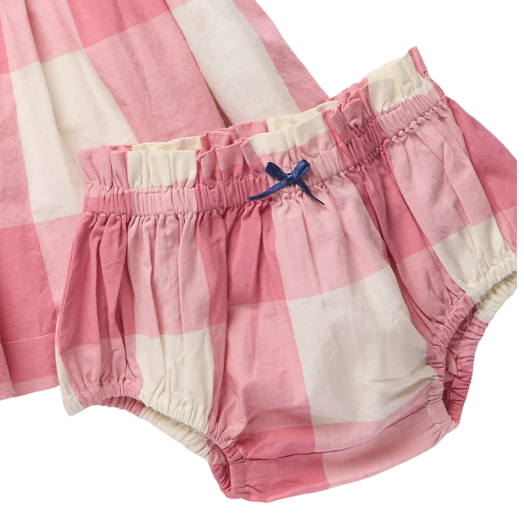 Pink and cream gingham baby bloomers with an elastic waistband and a small blue bow, shown on a white background.