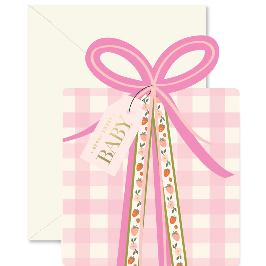 Baby shower invitation with pink bow and 'It's a girl' tag on a checkered background