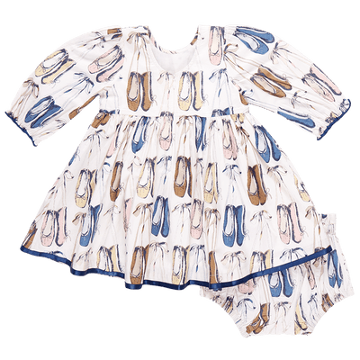 the back of the ballet slipper dress. Ballet slippers throughout the dress. Blue, beige, taupe and navy ribbon trim on the bottom. 