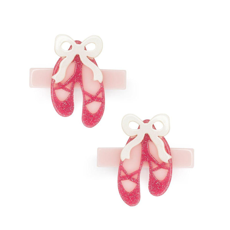 pink glitter ballet slippers with pearlized beige ribbons attached. 