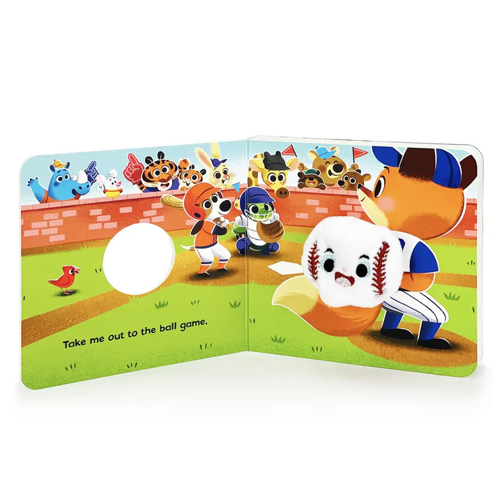 Children's book open to a page with cartoon characters on a baseball field