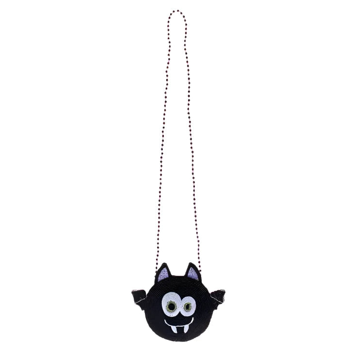 beaded bag, crossbody strap. bag is in the shape of a bat, the color of the bat is black with the insides of the ears being  purple. the bat is making a silly face