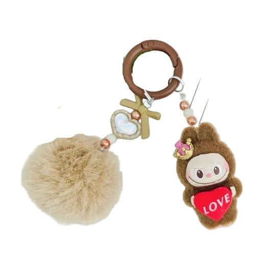 Keychain with the brown labubu charachter holding a heart and fluffy ball on a white background