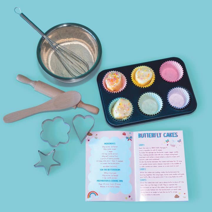 baking pan, muffin liners, bowl and whisk with cookie cutters and recipe booklet. 