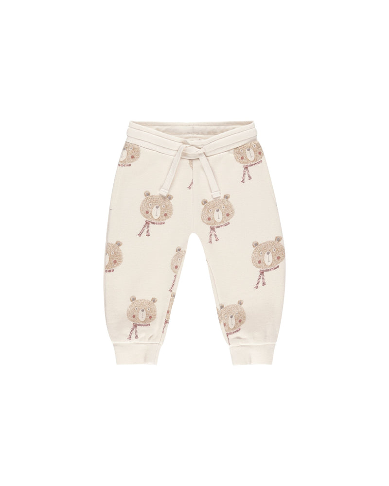 beige joggers with bears wearing scarves. it is just the bear head and not the body.