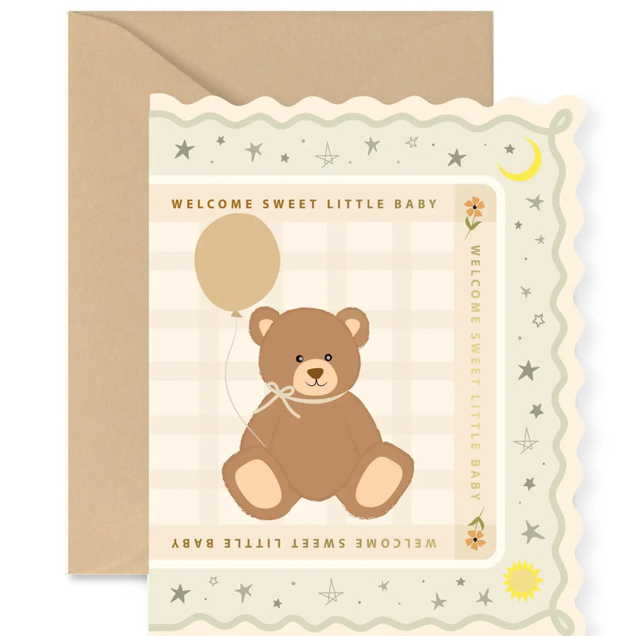 Baby shower card with a teddy bear and balloon design on a beige background