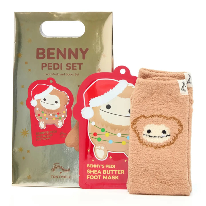 A Tony Holy Benny Pedi Set foot mask and socks gift set, featuring a beige metallic gift bag, a red Santa-themed foot mask, and a pair of beige fleece socks with a lion face design.