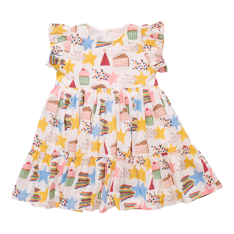 Colorful children's dress with star and cupcake pattern on a white background