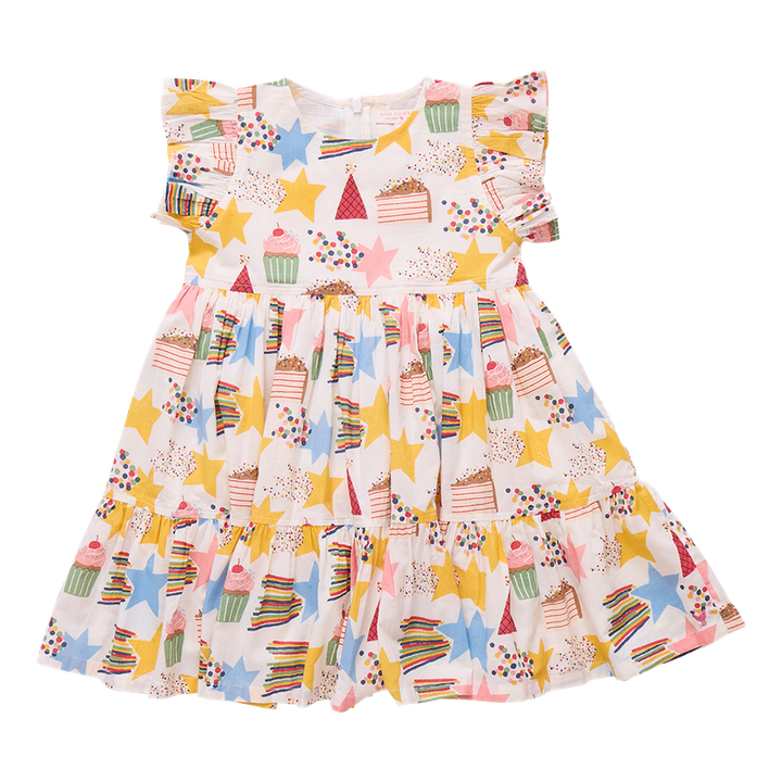 Colorful children's dress with star and cupcake pattern on a white background
