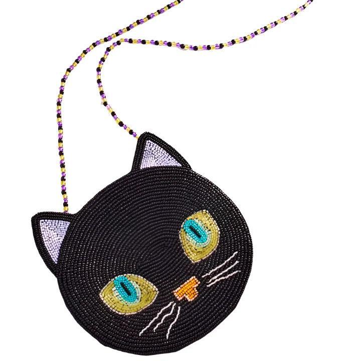 close up of the beaded bag, black cat in the gold eyes and green centers. small ears with white centers. crossbody styling. 