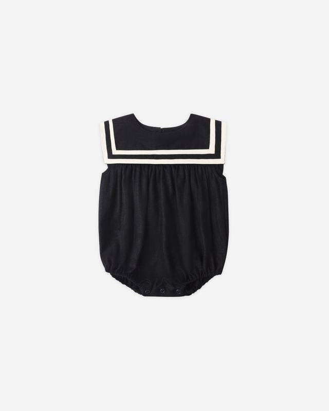 black sailor baby outfit with white trim. 