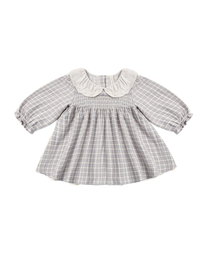 Baby dress with checkered pattern and white collar on a white background