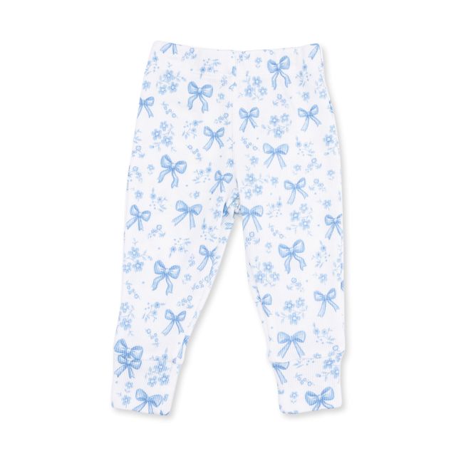 pants that go to a 2 piece set, the top as a ruffle on the collar. the print has a white base with a light blue bow and flower print. 