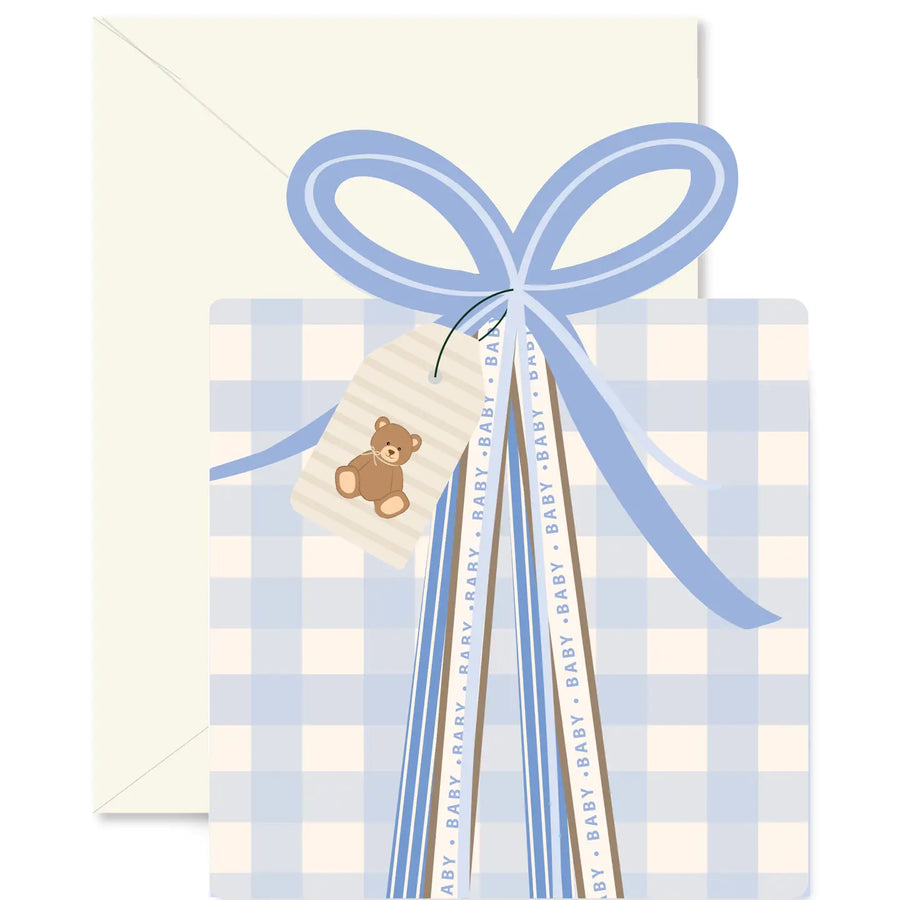 Baby card with blue bow, checkered pattern, and teddy bear tag on a white background