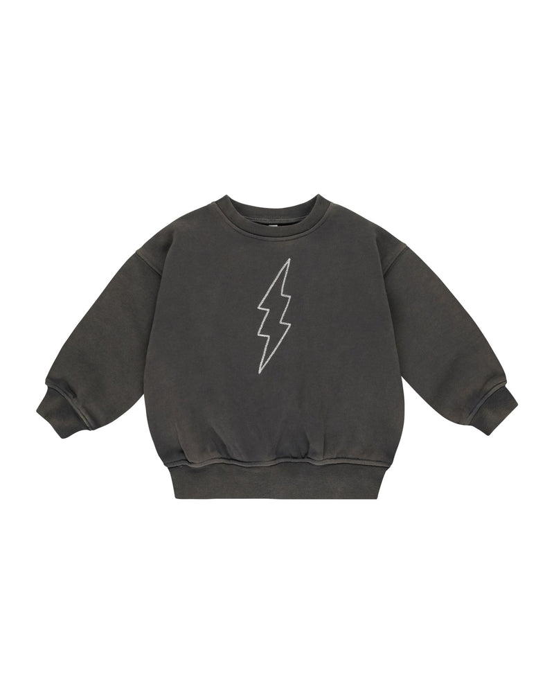 washed out gray/black sweatshirt with white lightning bolt on it. 