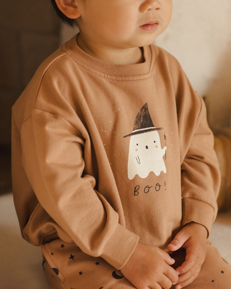 close up of the ghost sweatshirt with little ghost wearing the witch hat and a wand. It says "Boo" under the ghost. 