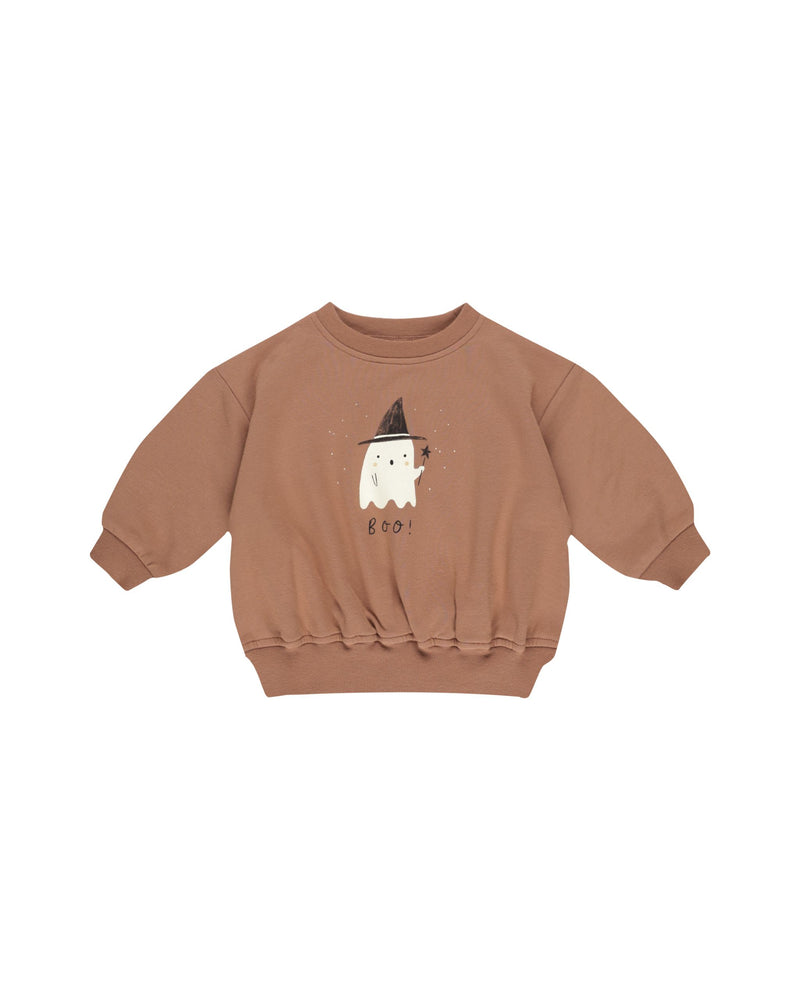 picture of the ghost sweatshirt on its own. rust color sweatshirt with a ghost on it holding a wand. under the ghost says "Boo"