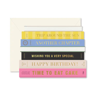 stack of books with titles that reference having a birthday as a title. Birthday card. 