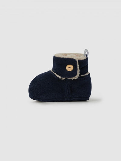 side view of the baby booties. navy in color and fleece lined. 