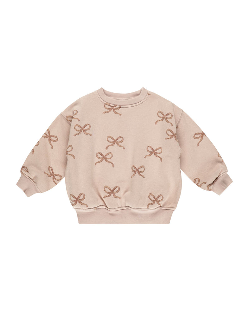 dusty rose sweatshirt with cinnamon bows all over the sweasthirt