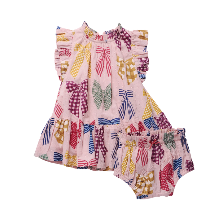 A baby girl's two-piece outfit set consisting of a ruffled sleeveless top and matching ruffled bloomers, both in light pink fabric with a colorful pattern of large bow prints in red, yellow, blue, and green gingham and solid colors.