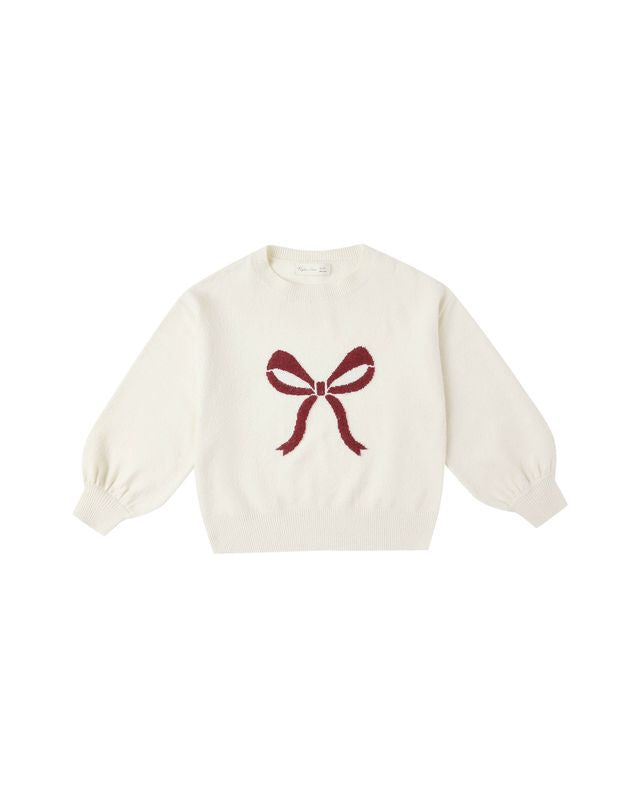 White sweater with a burgundy bow design on a white background